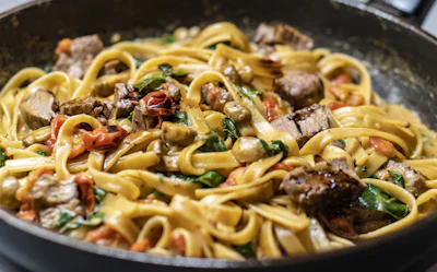 Fuudr fresh homemade Italian pasta dish with rich tomato marinara sauce